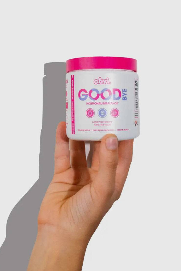 Hand holding Obvi Good Bye Hormonal Balance