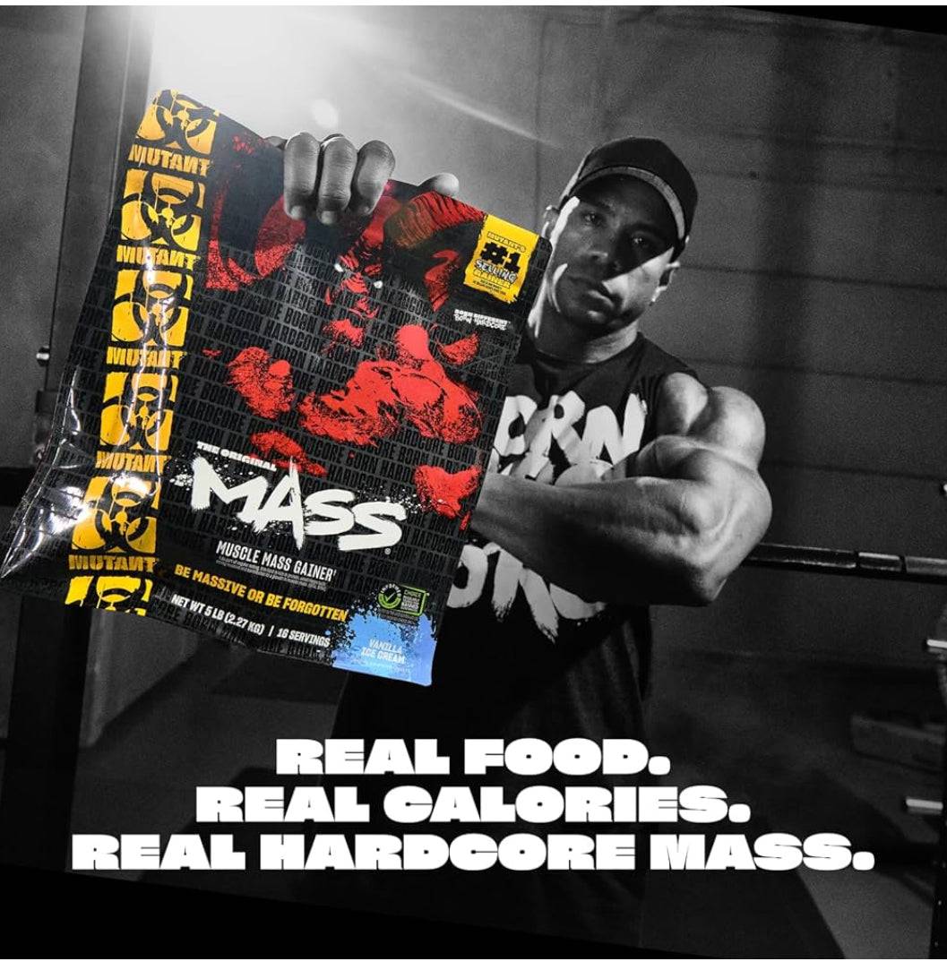 Bodybuilder holding Mutant Mass Gainer pack with slogan 'Real Food. Real Calories. Real Hardcore Mass.' promoting high-calorie protein powder.