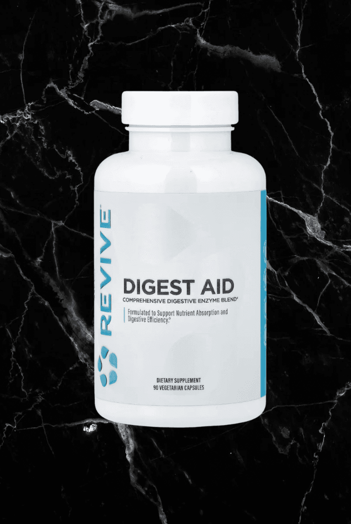 Revive Digest Aid enzyme supplement bottle on black marble background. Affordable Digest Aid supports digestion of protein, fat, and starch.
