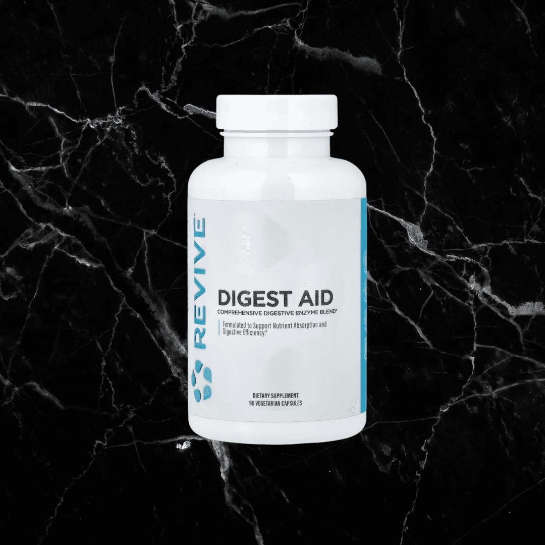 Revive Digest Aid enzyme supplement bottle on black marble background. Affordable Digest Aid supports digestion of protein, fat, and starch.