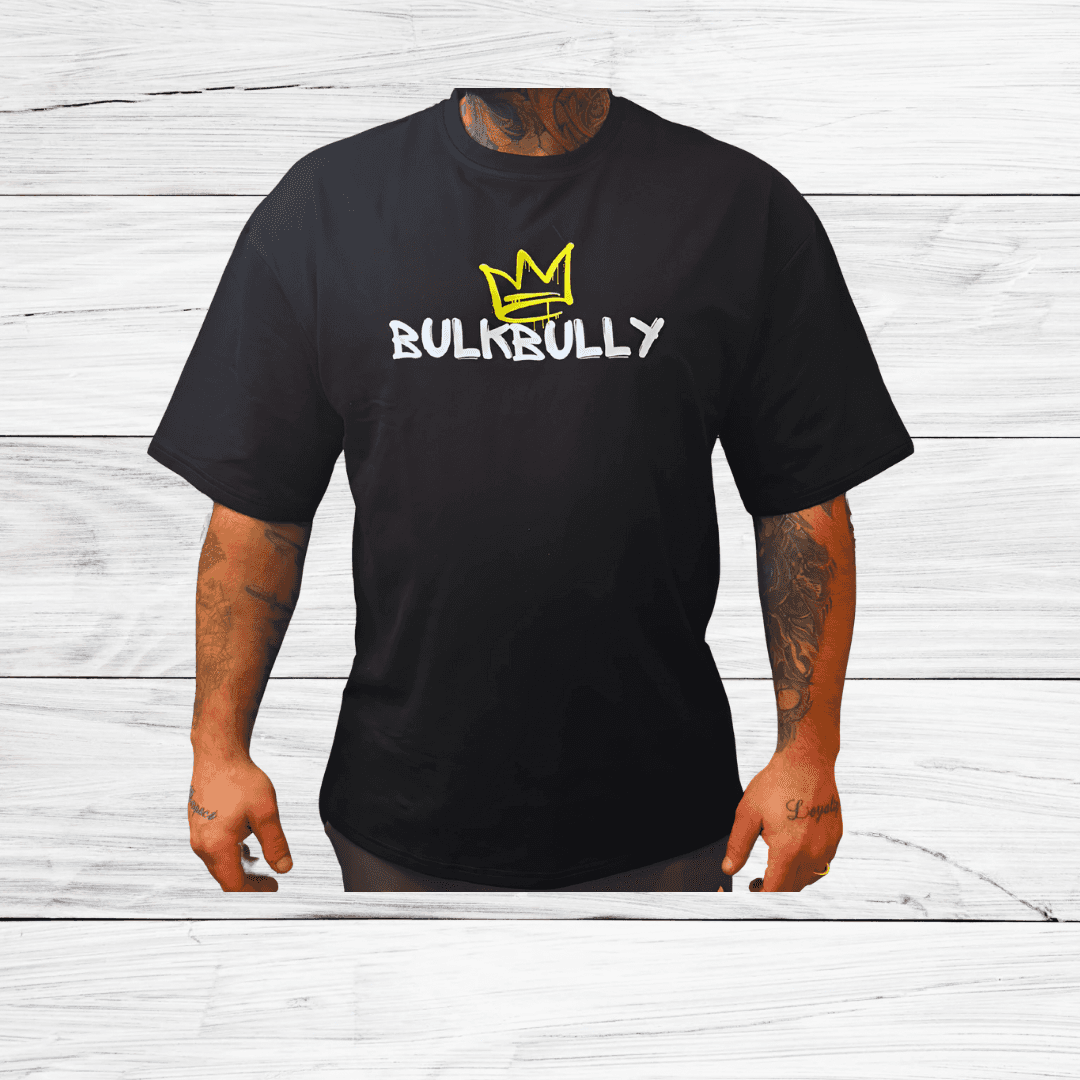 Mens Black Oversized Tee from BulkBullys G.O.A.L.S Collection featuring bold BULKBULLY logo with yellow crown on front. Relaxed fit for streetwear style.
