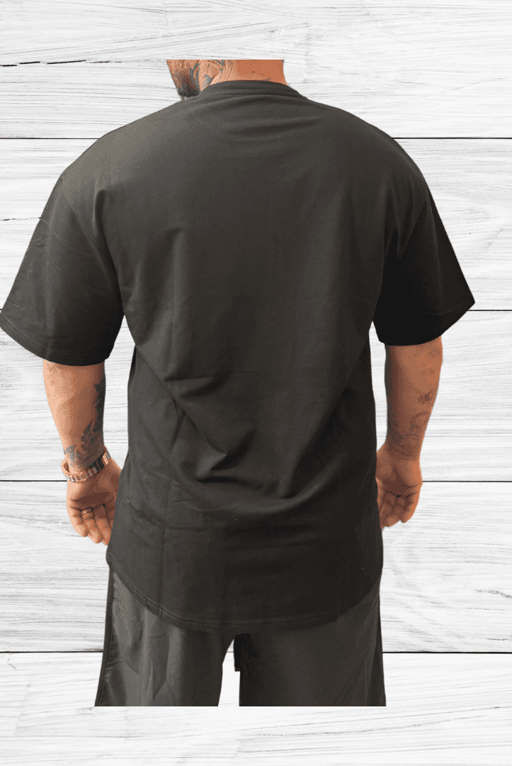 Back view of Mens Black Oversized Tee from BulkBullys G.O.A.L.S Collection showing extended length and loose fit ideal for casual wear.