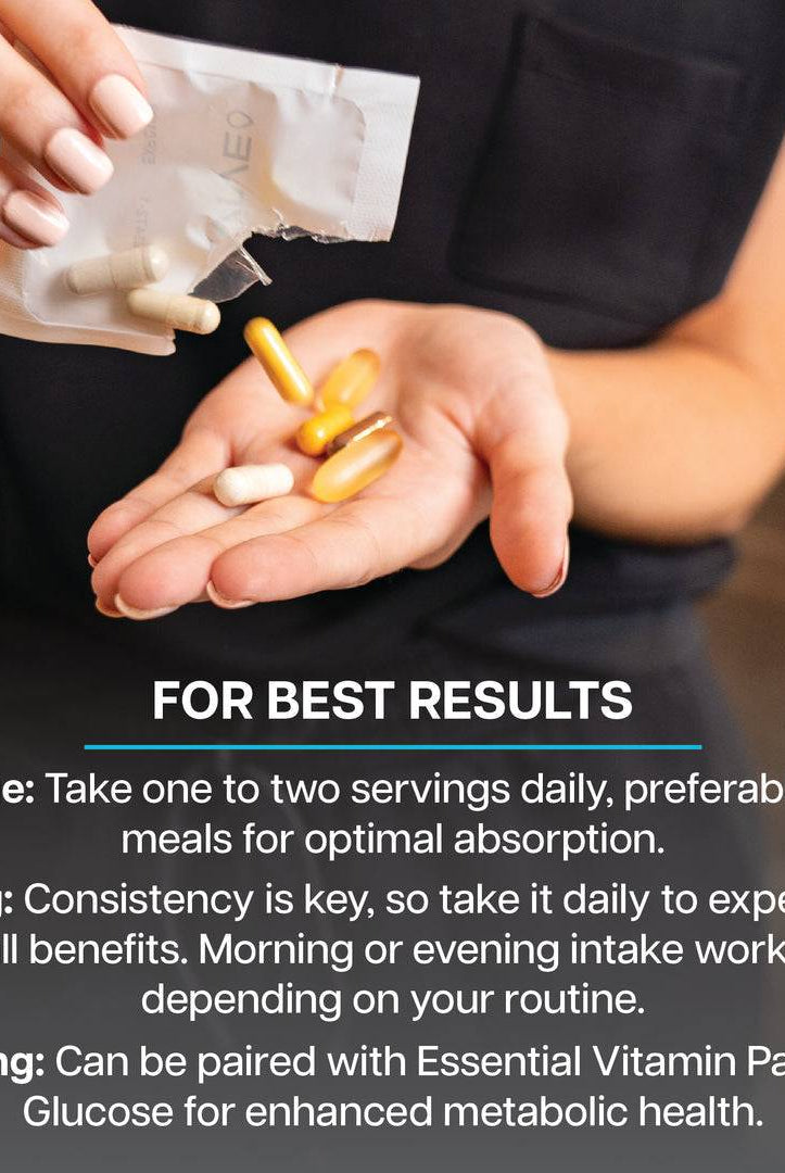 Hand holding Revive Vitamin Pack supplements with dosage and pairing instructions for optimal daily health and nutrient absorption.