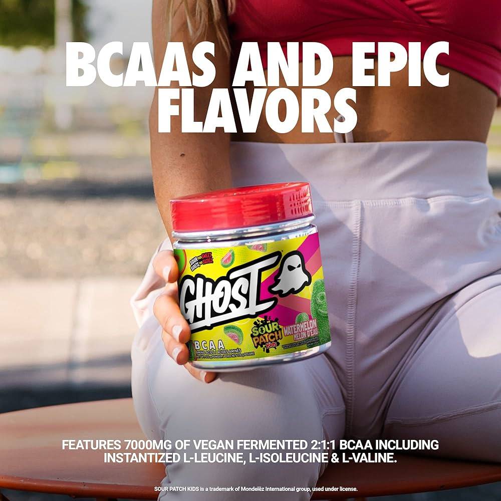 Close-up of GHOST BCAAs Sour Patch Kids Watermelon tub with text highlighting 7000mg of vegan fermented BCAAs and epic flavors.