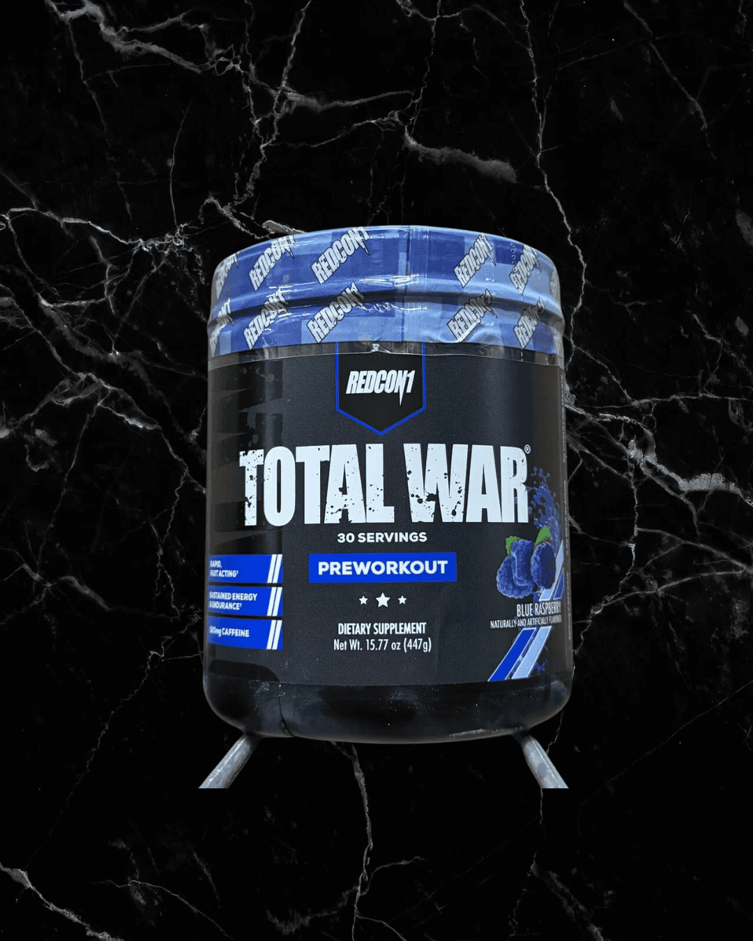 Redcon1 Total War Pre-Workout in Blue Raspberry flavor. High-stimulant formula with 320mg caffeine and 3.2g beta-alanine per serving.