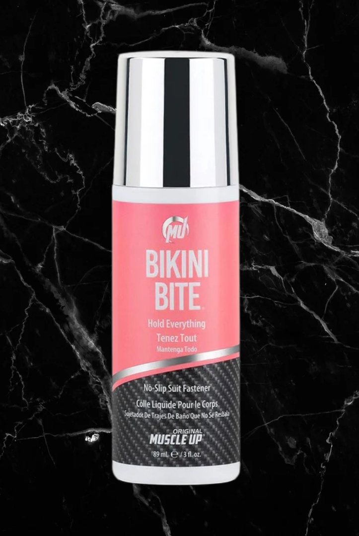 Pro Tan Bikini Bite bikini fastener with pink label and chrome cap, designed for secure no-slip hold on swimwear tops. Skin-friendly and easy to wash off.
