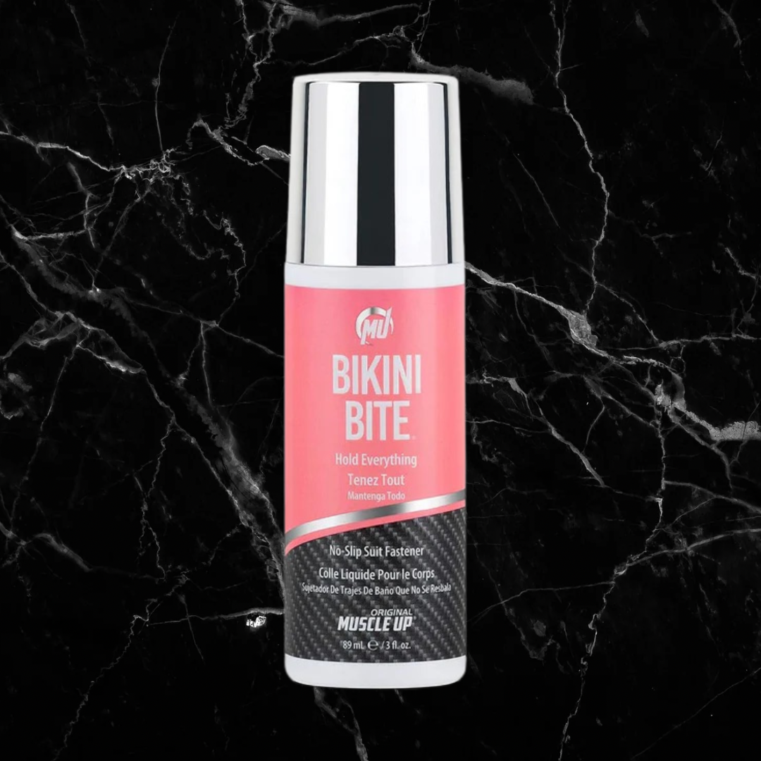Pro Tan Bikini Bite bikini fastener with pink label and chrome cap, designed for secure no-slip hold on swimwear tops. Skin-friendly and easy to wash off.