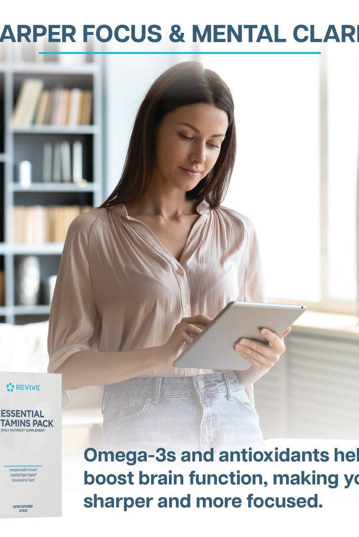 Woman using a tablet with Revive Vitamin Pack box shown, promoting mental clarity and sharper focus from omega-3s and antioxidants.