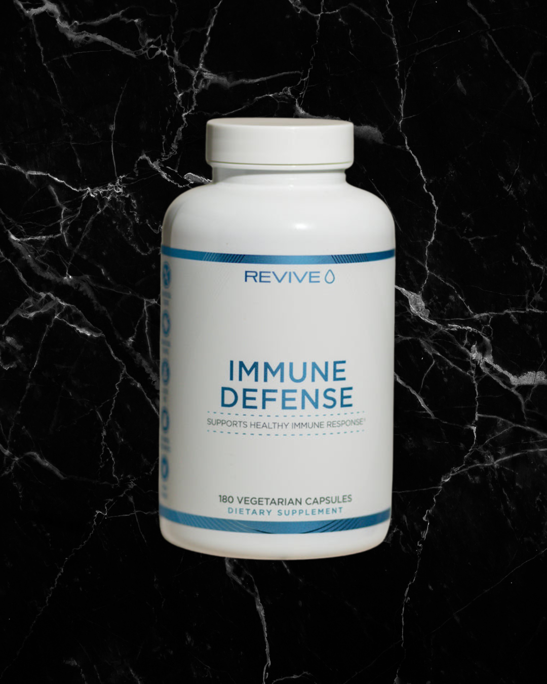 REVIVE Immune Defense Booster bottle with 180 vegetarian capsules, designed to support immune health with natural ingredients like Zinc and Vitamin C.