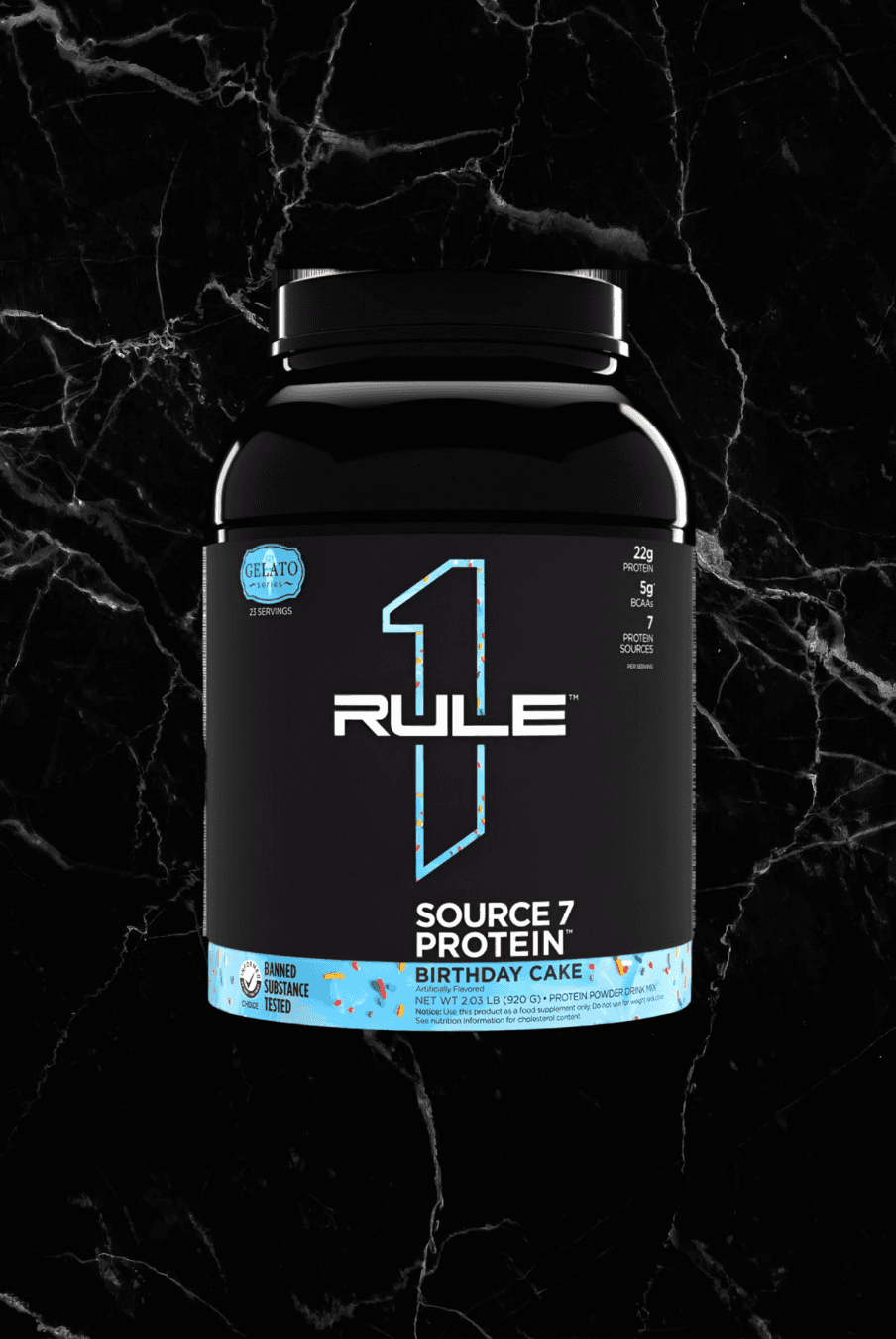 SOURCE 7 Protein Gelato Inspired - Birthday Cake flavor by Rule1, featuring 22g protein from 7 blends in a black container with blue accents.