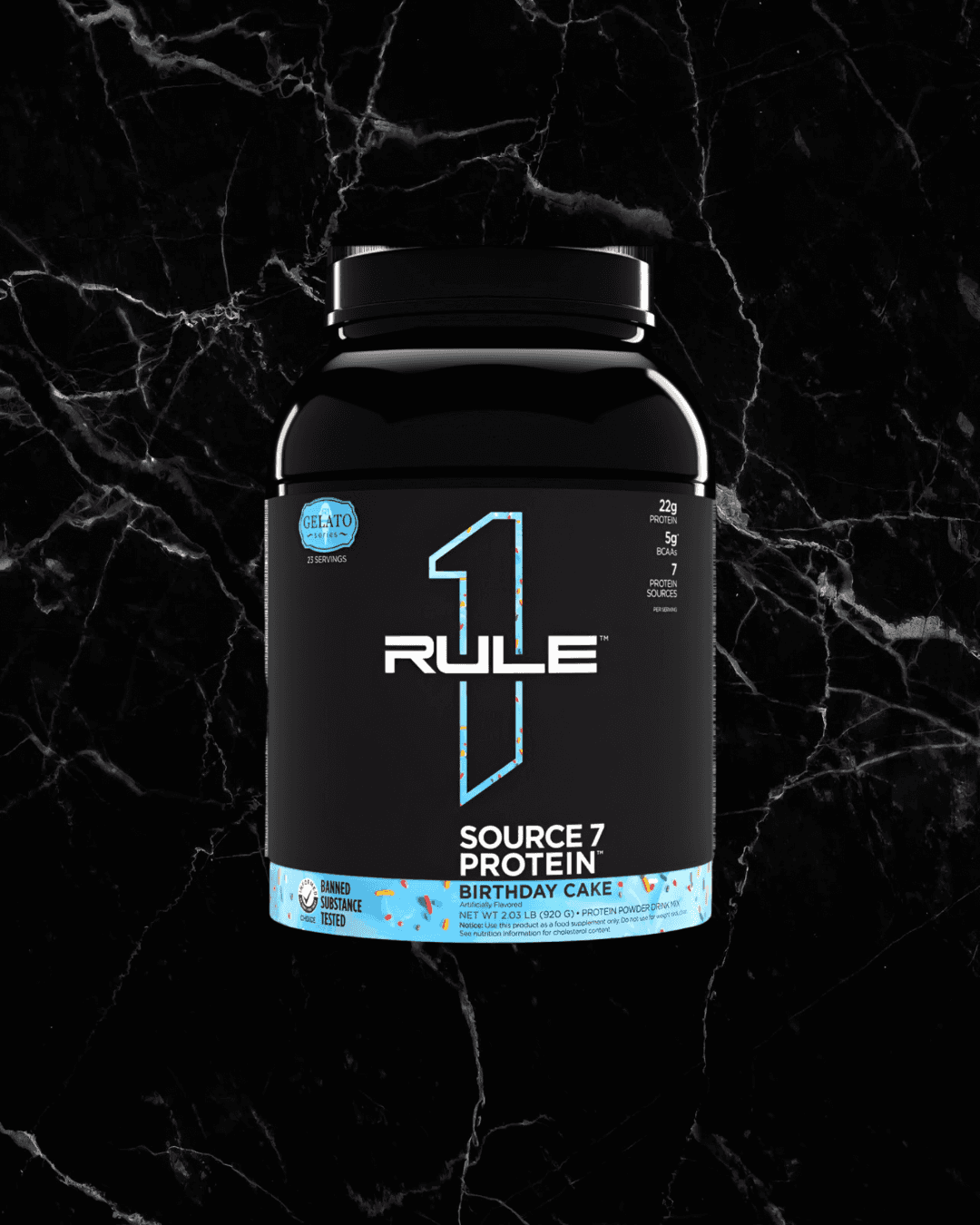 SOURCE 7 Protein Gelato Inspired - Birthday Cake flavor by Rule1, featuring 22g protein from 7 blends in a black container with blue accents.