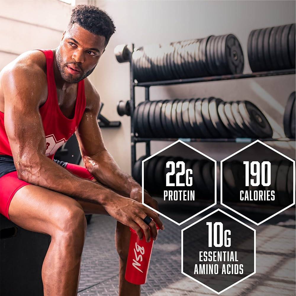 Man in gym with BSN shaker, showcasing BSN SYNTHA-6 protein benefits: 22g protein, 190 calories, and 10g essential amino acids.