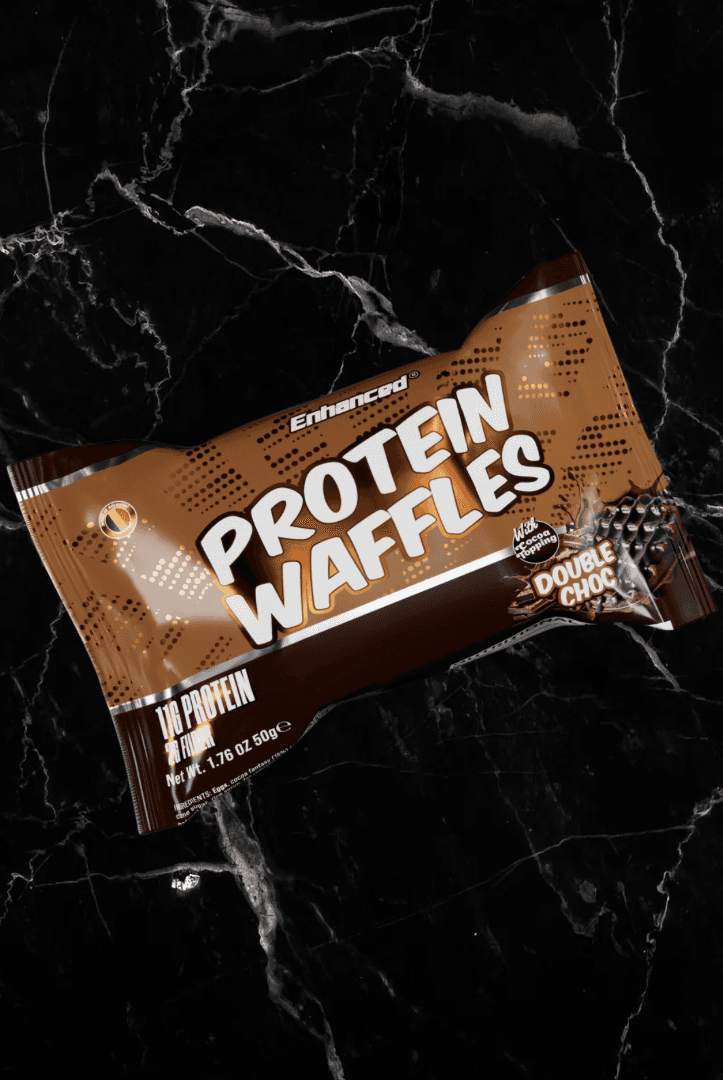 Enhanced Protein Waffles Double Choc Chip flavor in brown packaging, high protein snack with rich chocolate taste and 11g protein.