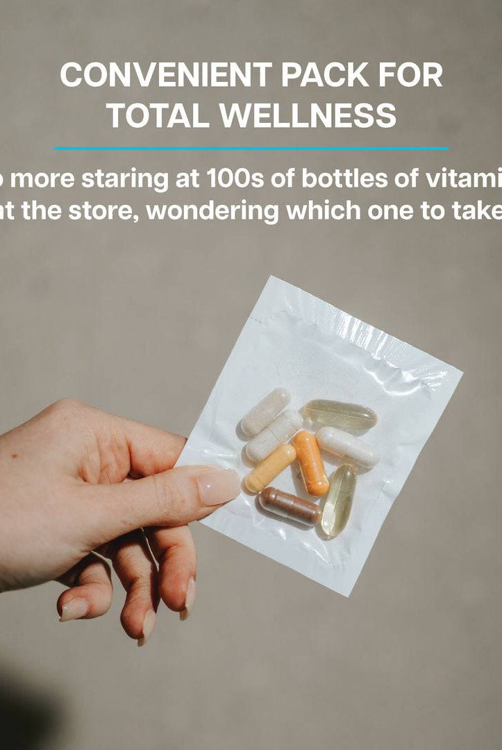 Single daily packet of Revive Vitamin Pack held in hand, emphasizing convenience and total wellness without confusion at the store.