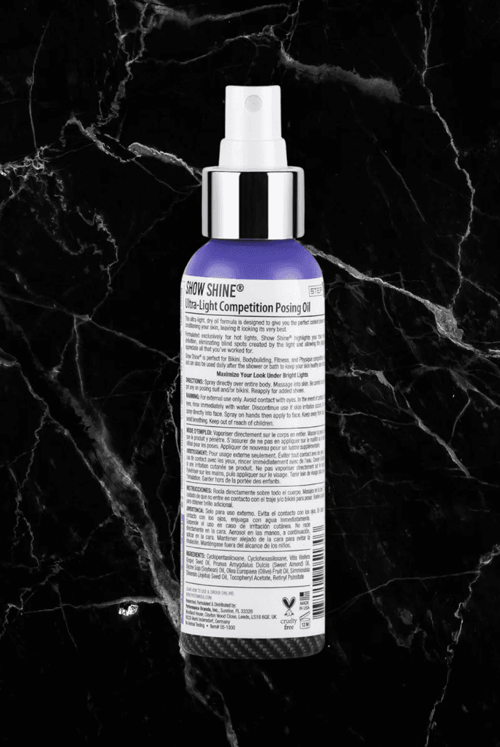 Back label of Pro Tan Show Shine Competition Posing Oil Spray showing usage directions and ingredients for bodybuilding and fitness use.