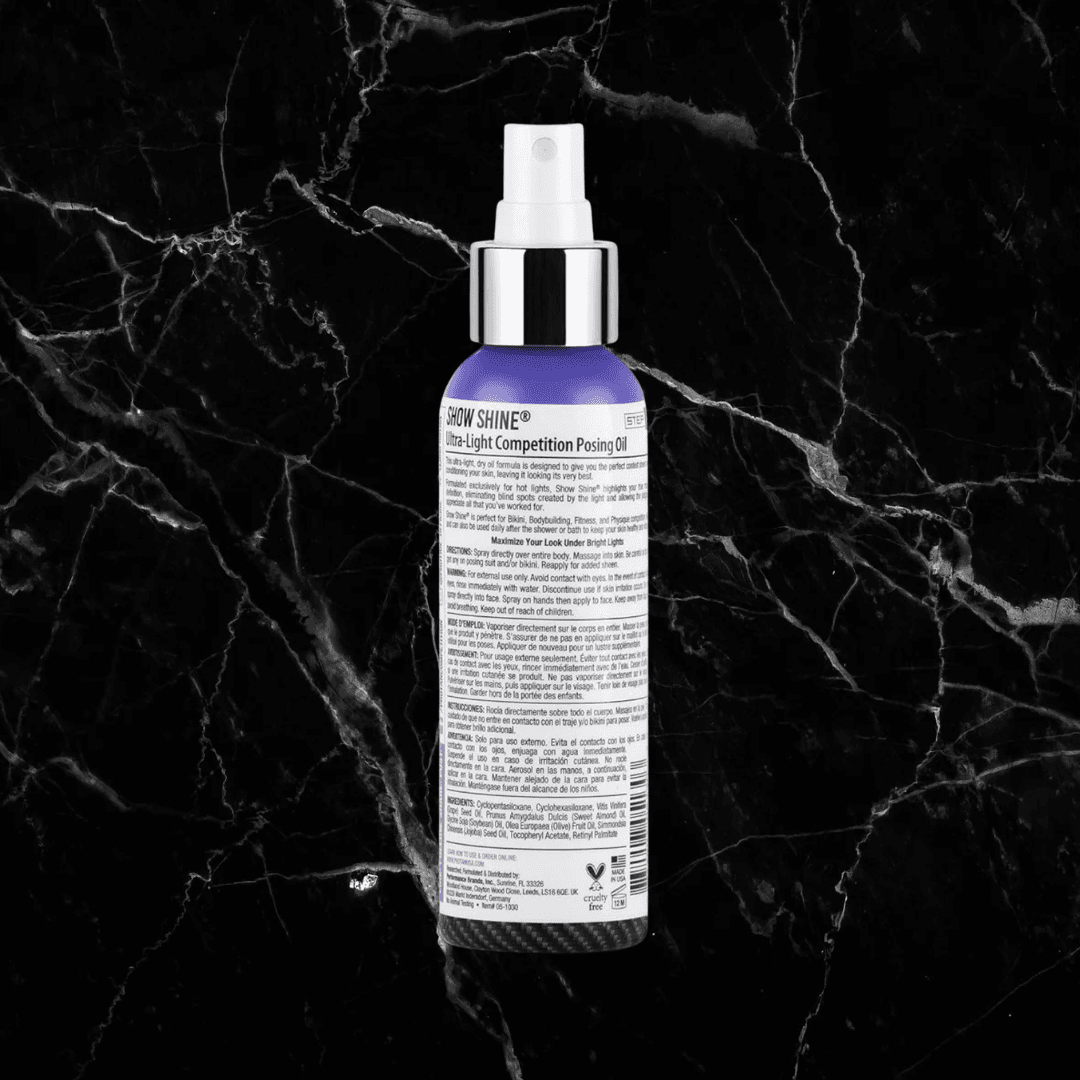 Back label of Pro Tan Show Shine Competition Posing Oil Spray showing usage directions and ingredients for bodybuilding and fitness use.