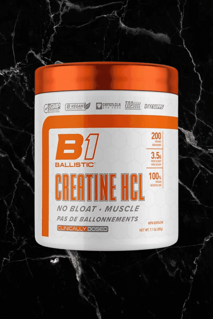 Ballistic Creatine HCL supplement container with orange lid, labeled for muscle strength, no bloat, and clinically dosed formula.