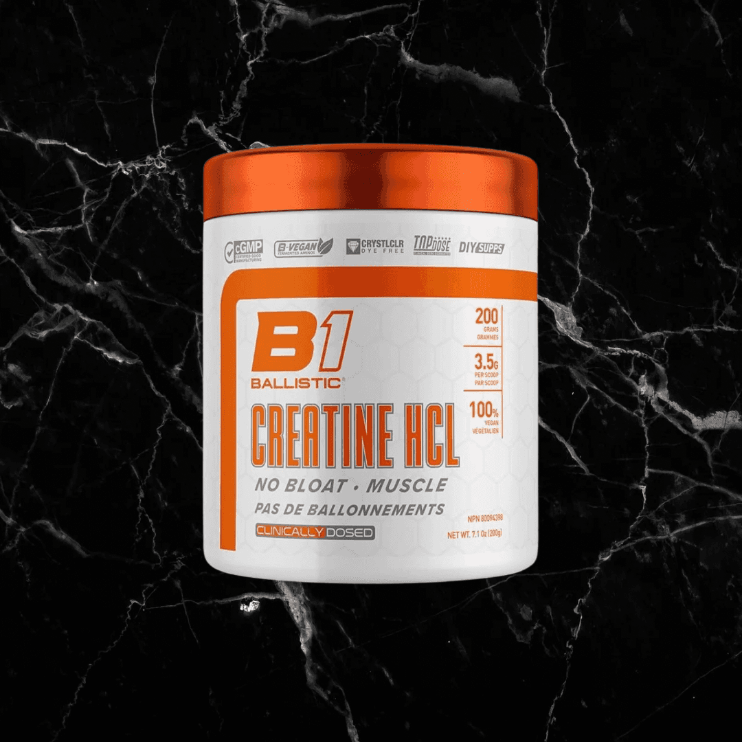 Ballistic Creatine HCL supplement container with orange lid, labeled for muscle strength, no bloat, and clinically dosed formula.