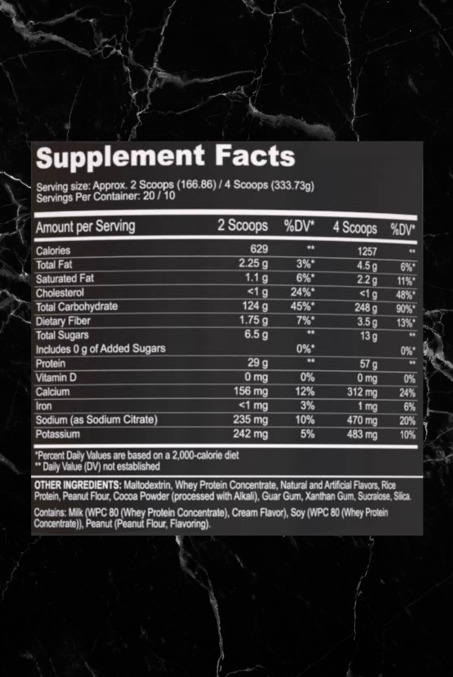 Supplement facts label for Black Magic Mass Gainer showing nutritional values for 2 and 4 scoops, including calories, protein, and ingredients.