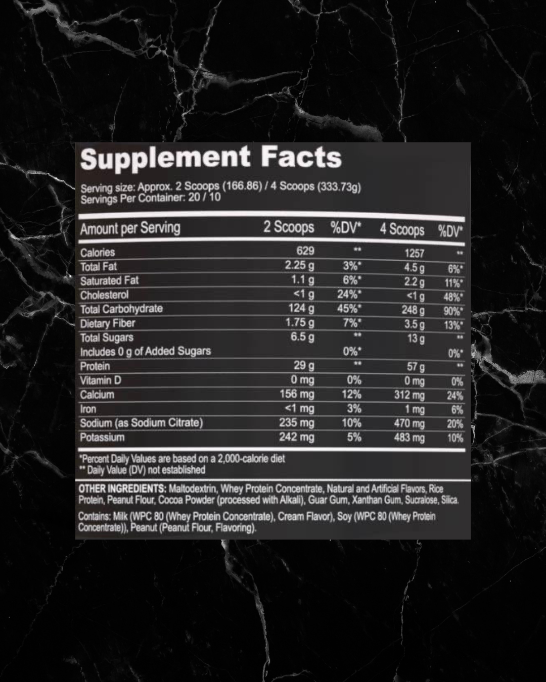 Supplement facts label for Black Magic Mass Gainer showing nutritional values for 2 and 4 scoops, including calories, protein, and ingredients.