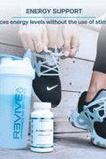 AdrenalCORE bottle next to athletic shoes and shaker bottle, emphasizing stimulant-free energy support for active lifestyles.
