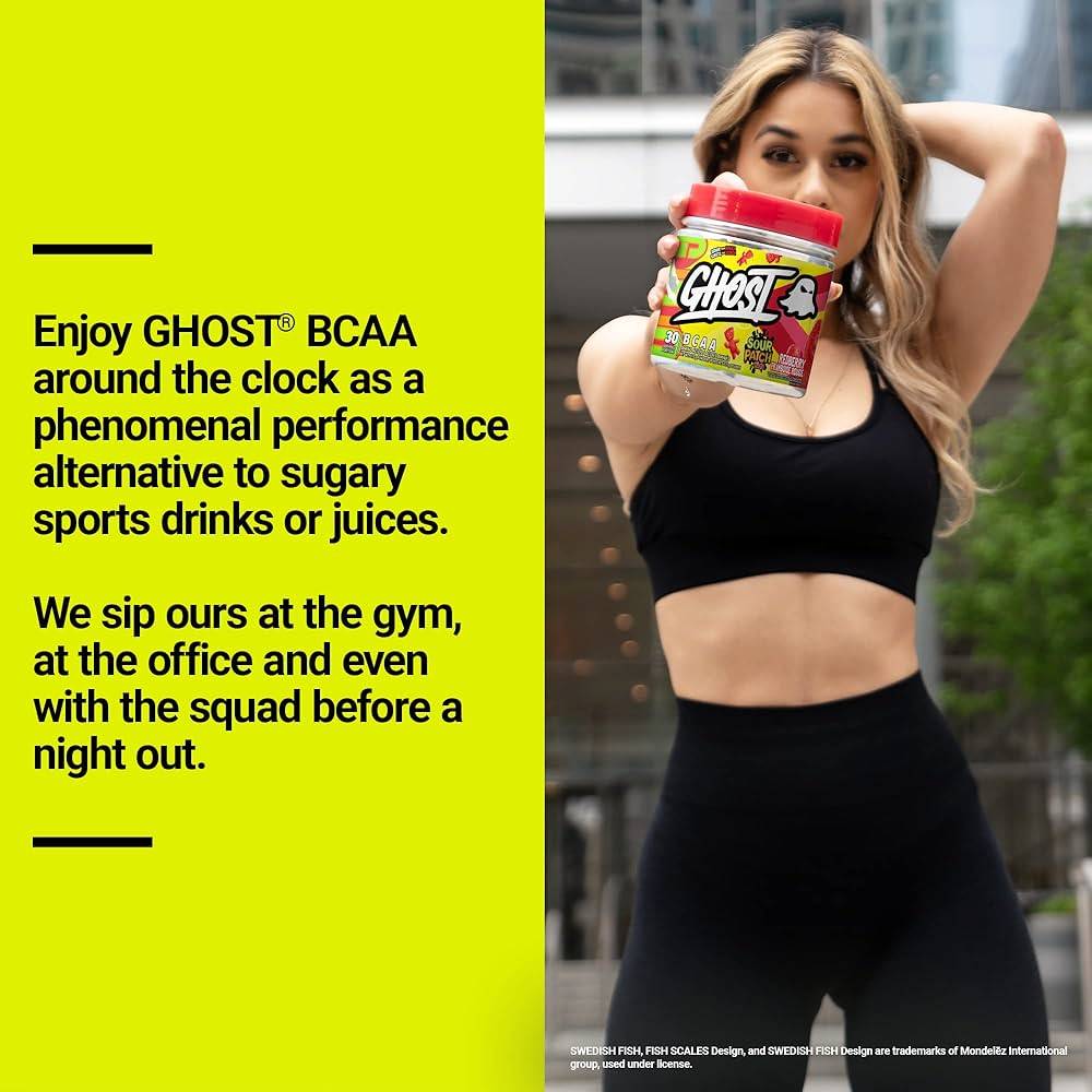 Woman in workout gear holding GHOST BCAAs Sour Patch Kids, promoting it as a performance drink alternative to sugary beverages.