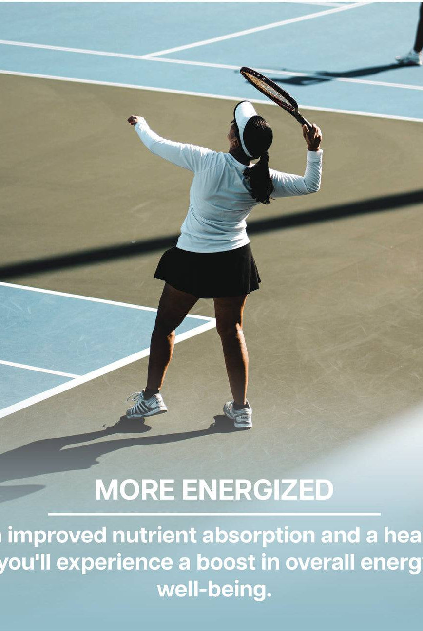 Woman playing tennis, representing increased energy and wellness from improved gut health with Revive Zinc Carnosine supplement.