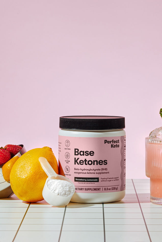 Strawberry Lemonade Perfect Keto Base Ketones with fresh fruits and drink, caffeine-free BHB mix for energy and mental clarity.