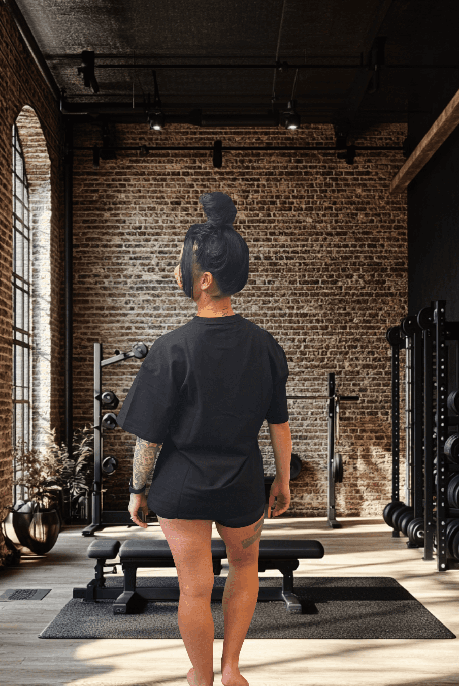 Back view of BulkBully G.O.A.L.S Collection Women's Black Oversized Tee, showcasing relaxed fit and casual gym-ready design.