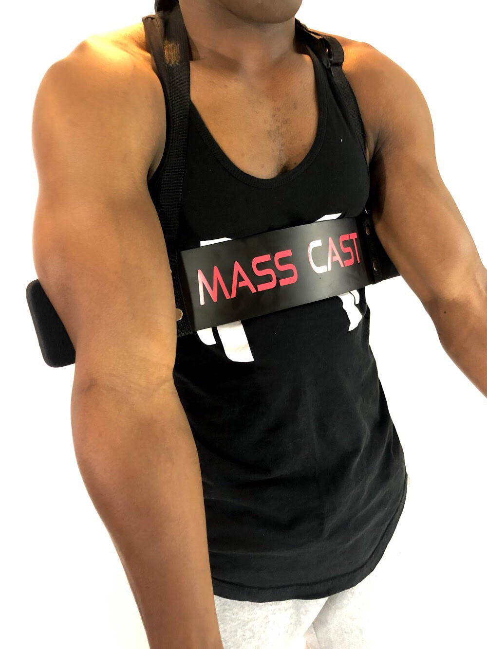 Arm Blaster for Enhanced Muscle Control and Posture Support by Mass Cast, worn during bicep curls for stabilized arm positioning and reduced fatigue.